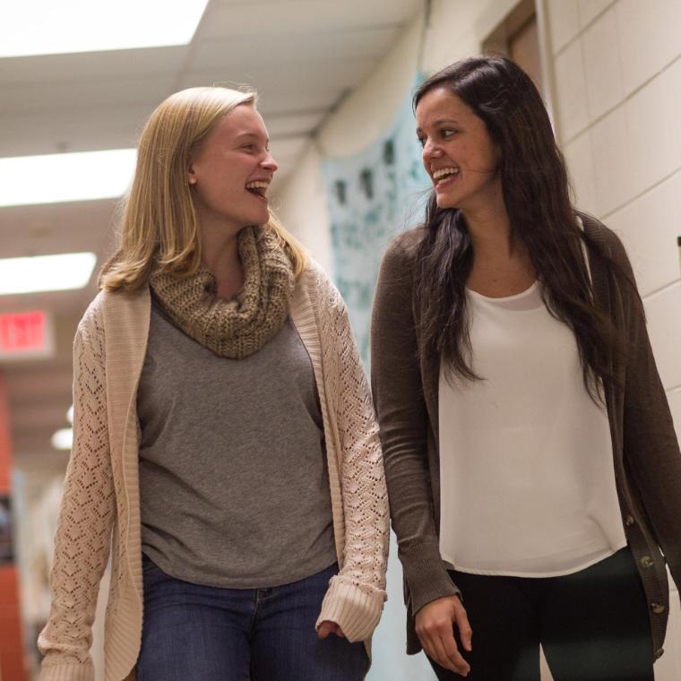 Two Female Wheaton College Students walking down the hall