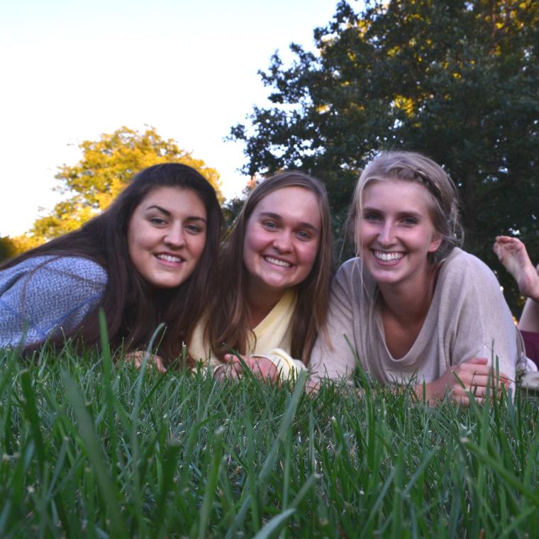 Three Wheaton College IL female students on lawn