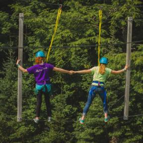 campers traverse the ropes course at HoneyRock in Three Lakes, WI