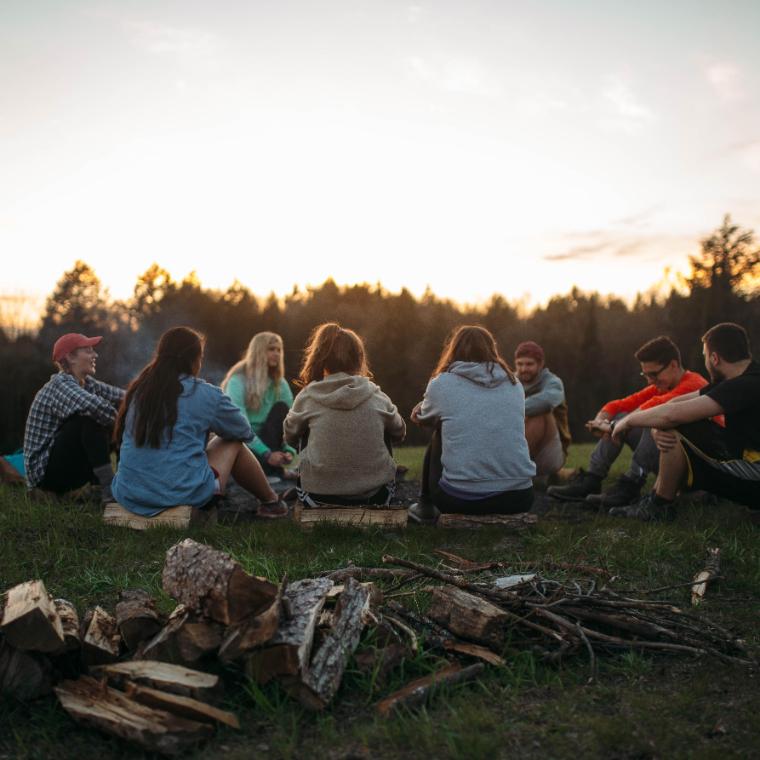 HoneyRock students sitting on Ski Hill