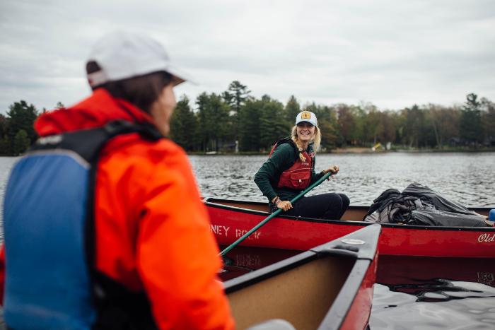 student and instructor canoe on long lake at honeyrock in three lakes, wi