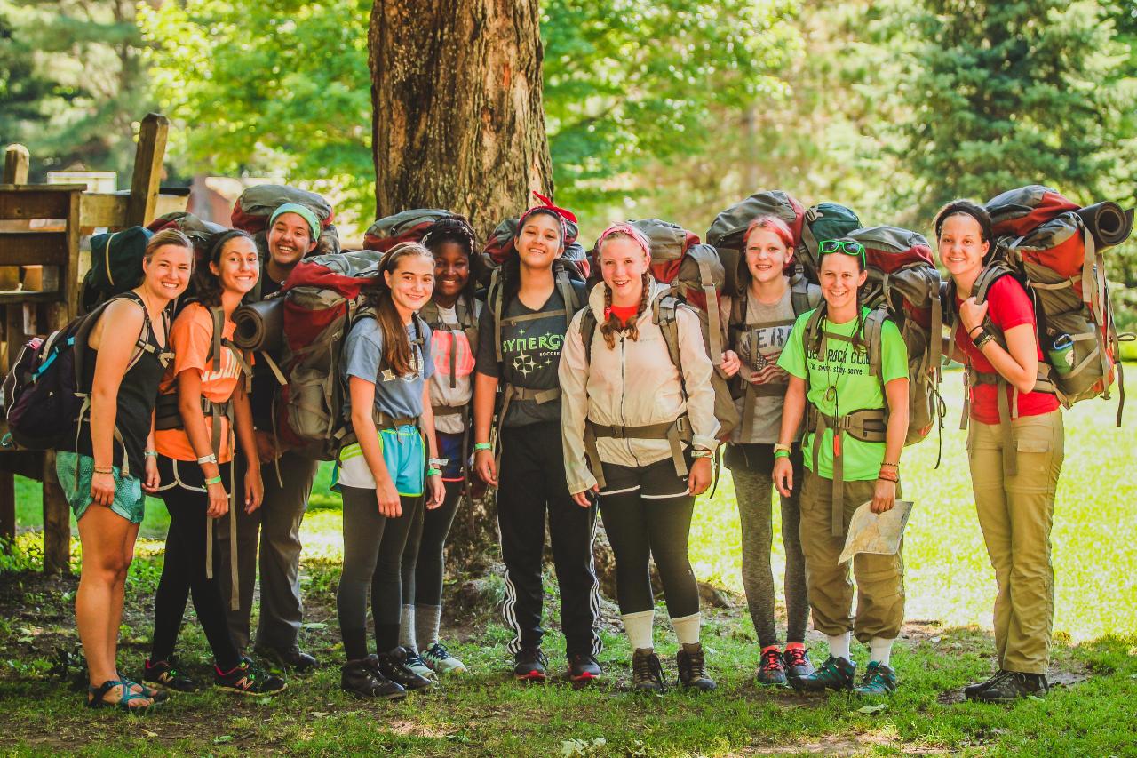 advance camp girls smiling before going out on trip at honeyrock in three lakes wi