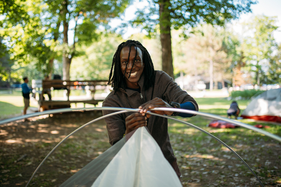 student setting up a tent