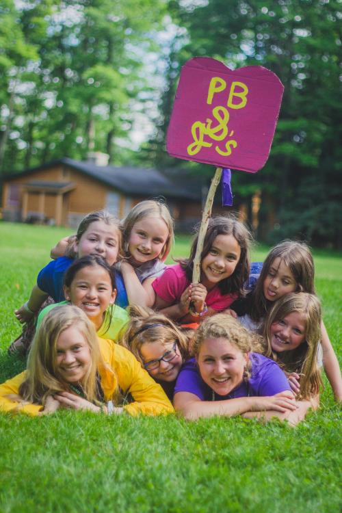 Two counselors with group of girls 