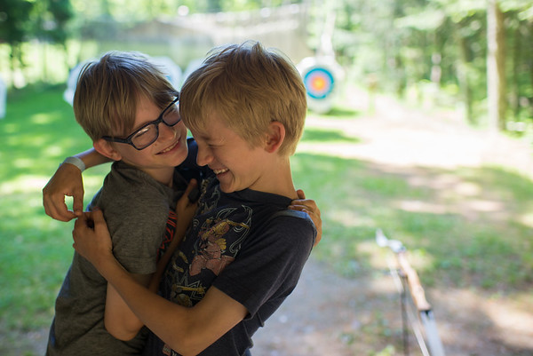 Brothers hugging at HoneyRock Camp in Three Lakes, WI