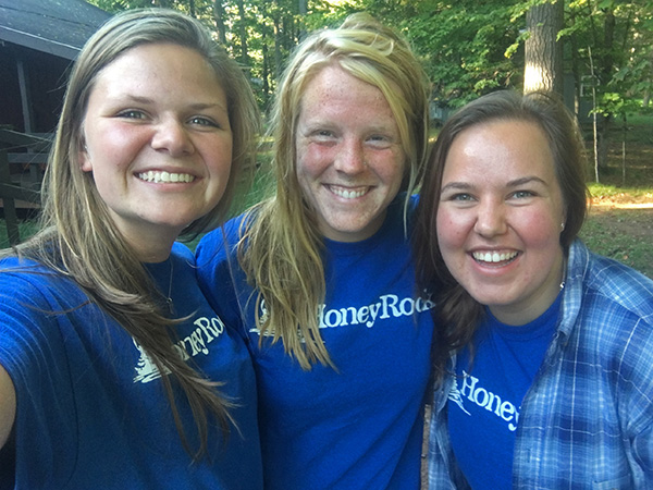 3 girls smiling blue Honeyrock shirts