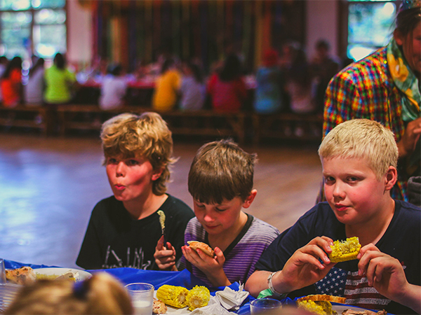 3 Boys Eating Honeyrock Dining Hall