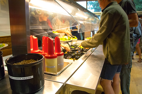 Person getting salad at Honeyrock