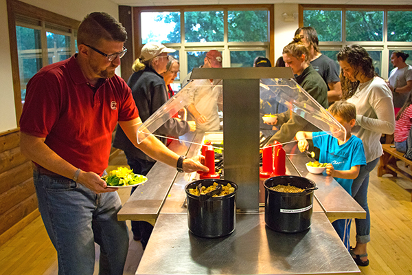 People getting salad in Chrouser at Honeyrock