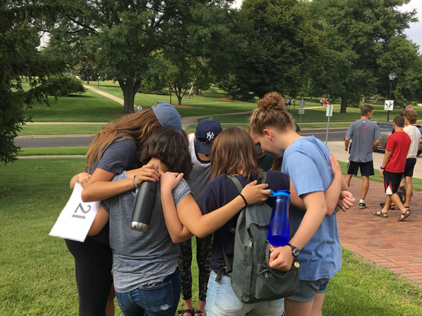 Group of Students Huddled Mid-Day