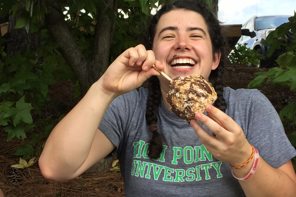 Young lady eating a delicious apple