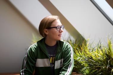 student sitting in a window seat