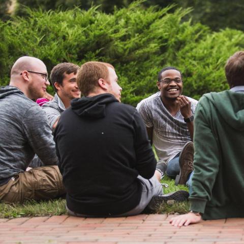 Graduate students having a picnic on the front campus