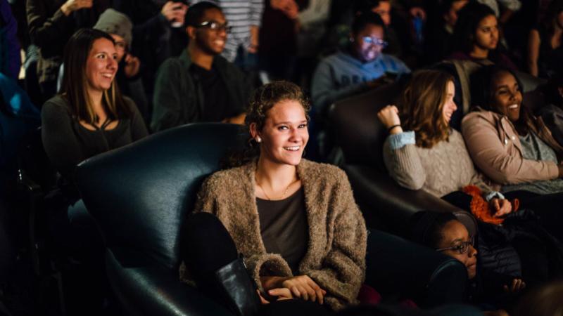 Student in student center watching TV