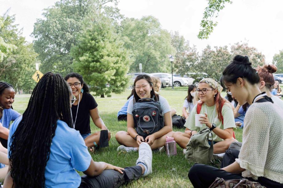 students talking in a circle